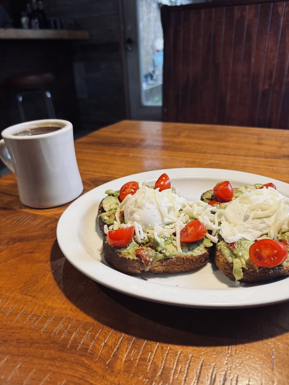 Avocado toast with a warm cup of coffee