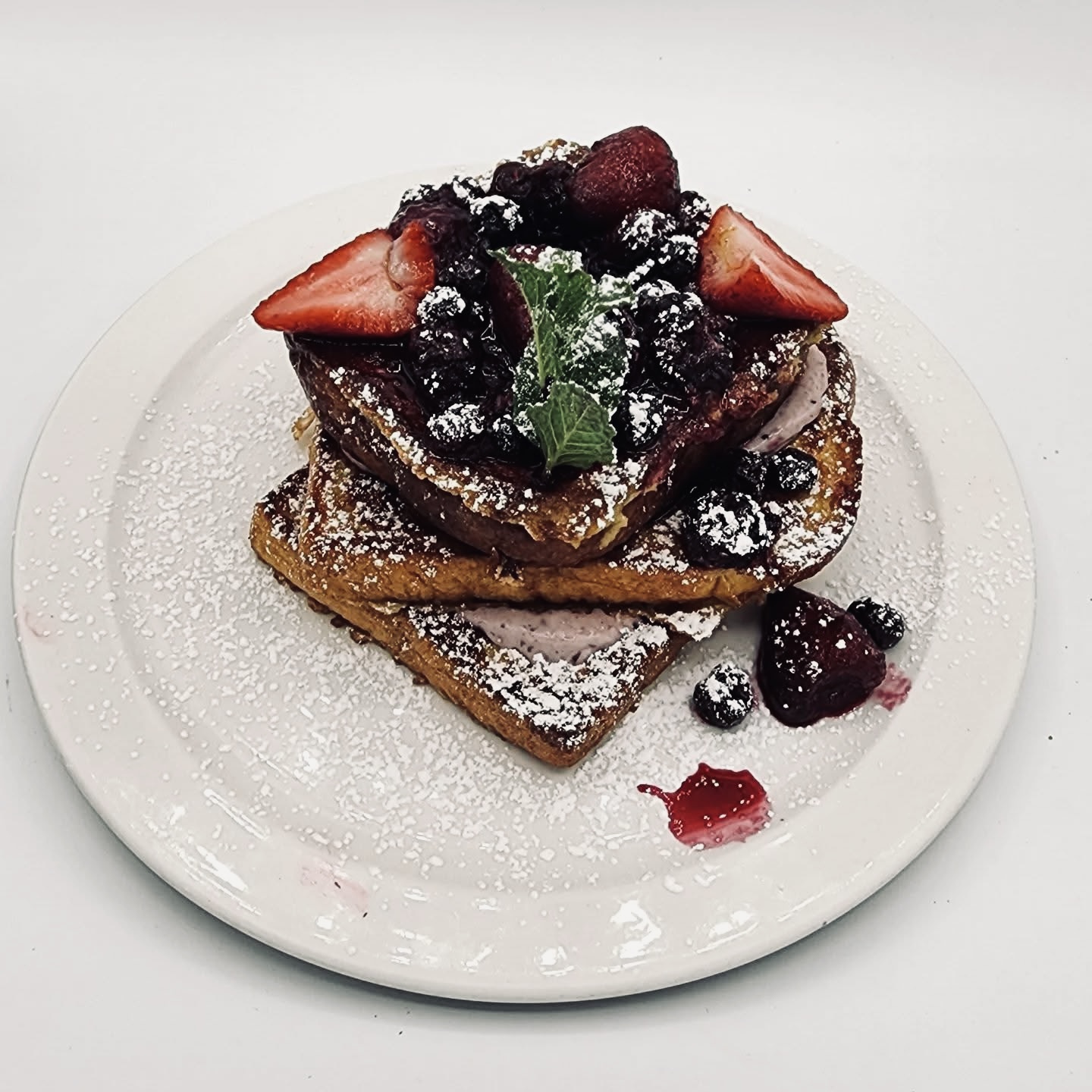 Berry french toast with powdered sugar